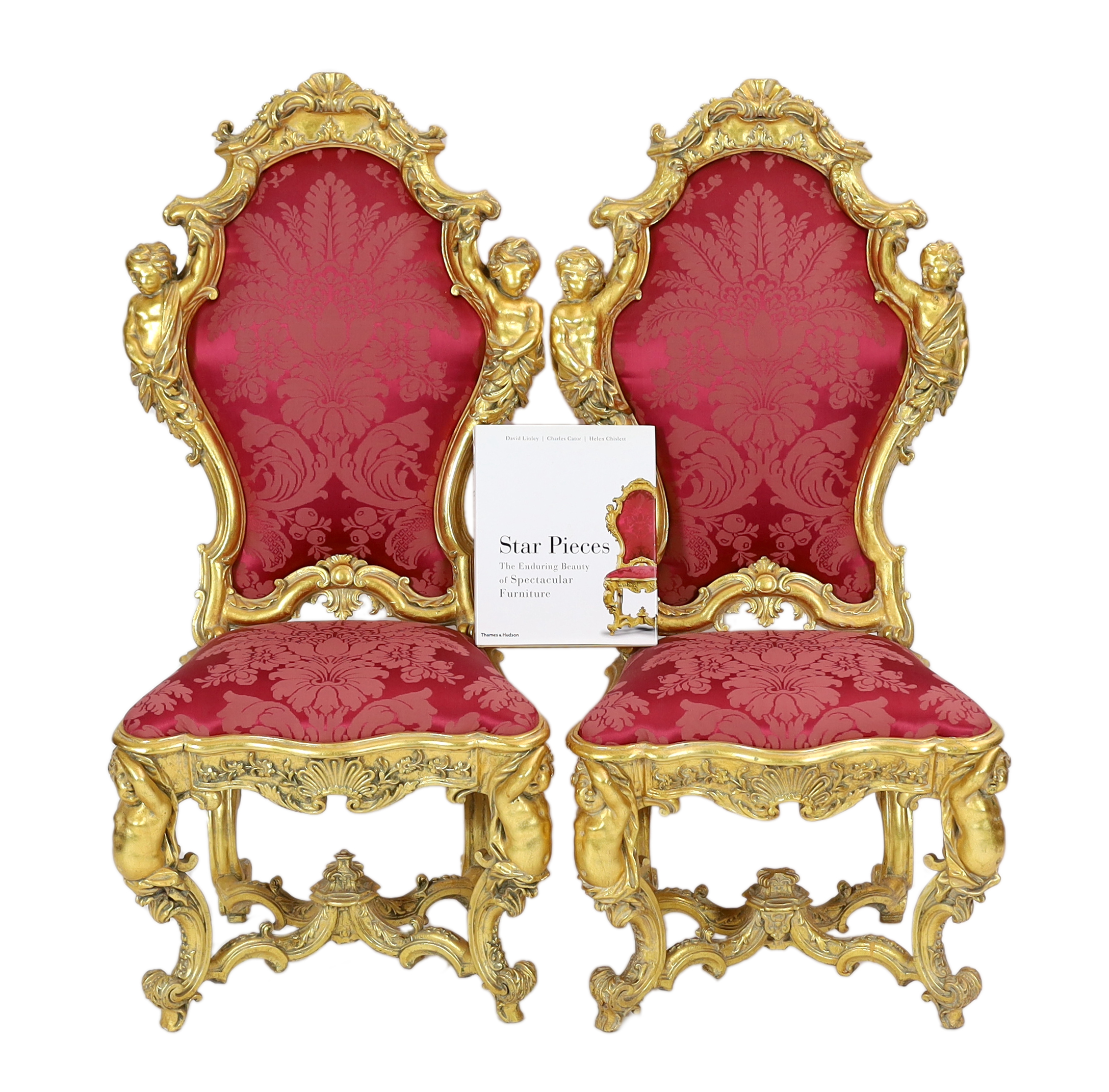 An important pair of late 18th century Venetian carved baroque giltwood throne chairs, the seats and backs upholstered in red floral silk. c.1770, 64cm wide, 55cm deep, 132cm high, Please note this lot attracts an additi